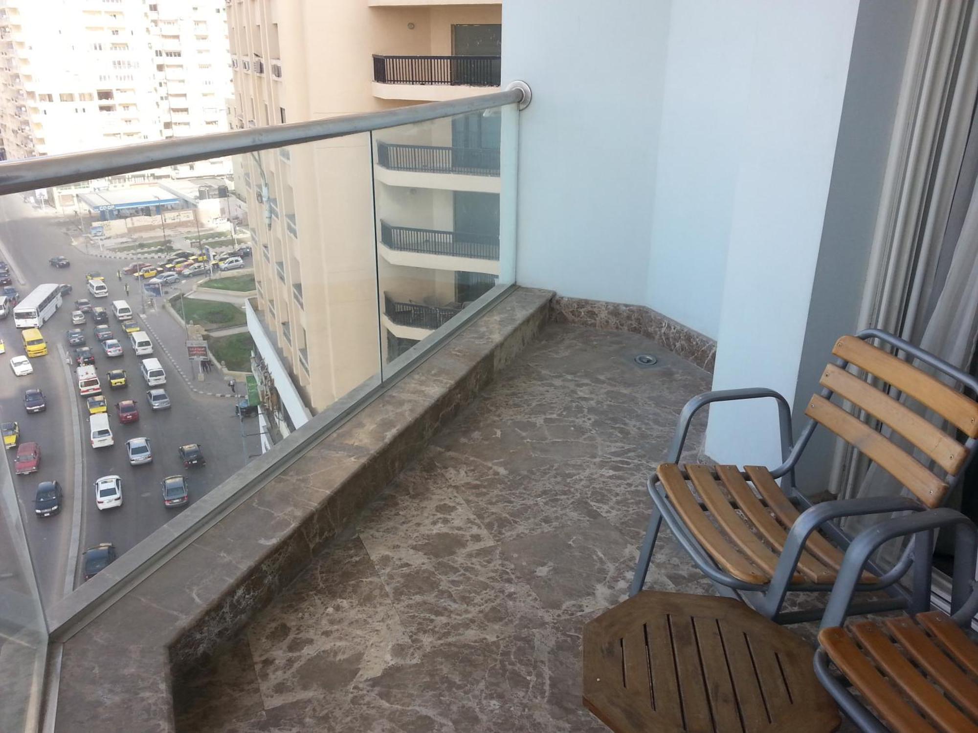 Hilton Alexandria Corniche Hotel Eksteriør bilde A balcony in a residential building in Cairo, Egypt